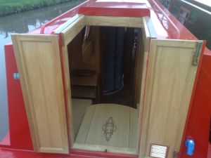 ross boats bespoke narrowboats and boat safety examinations -  - view from rear deck into bedroom/dinette with table in place - click to see image full size